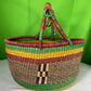 A Beautiful Hand Woven African Basket With A Leather Bound Handle