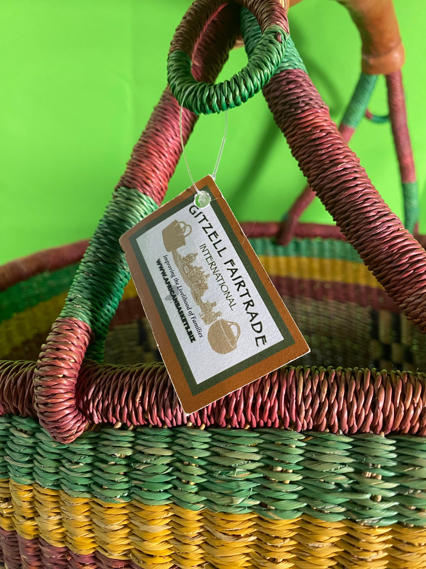 A Beautiful Hand Woven African Basket With A Leather Bound Handle