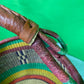 A Beautiful Hand Woven African Basket With A Leather Bound Handle