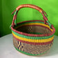 A Beautiful Hand Woven African Basket With A Leather Bound Handle