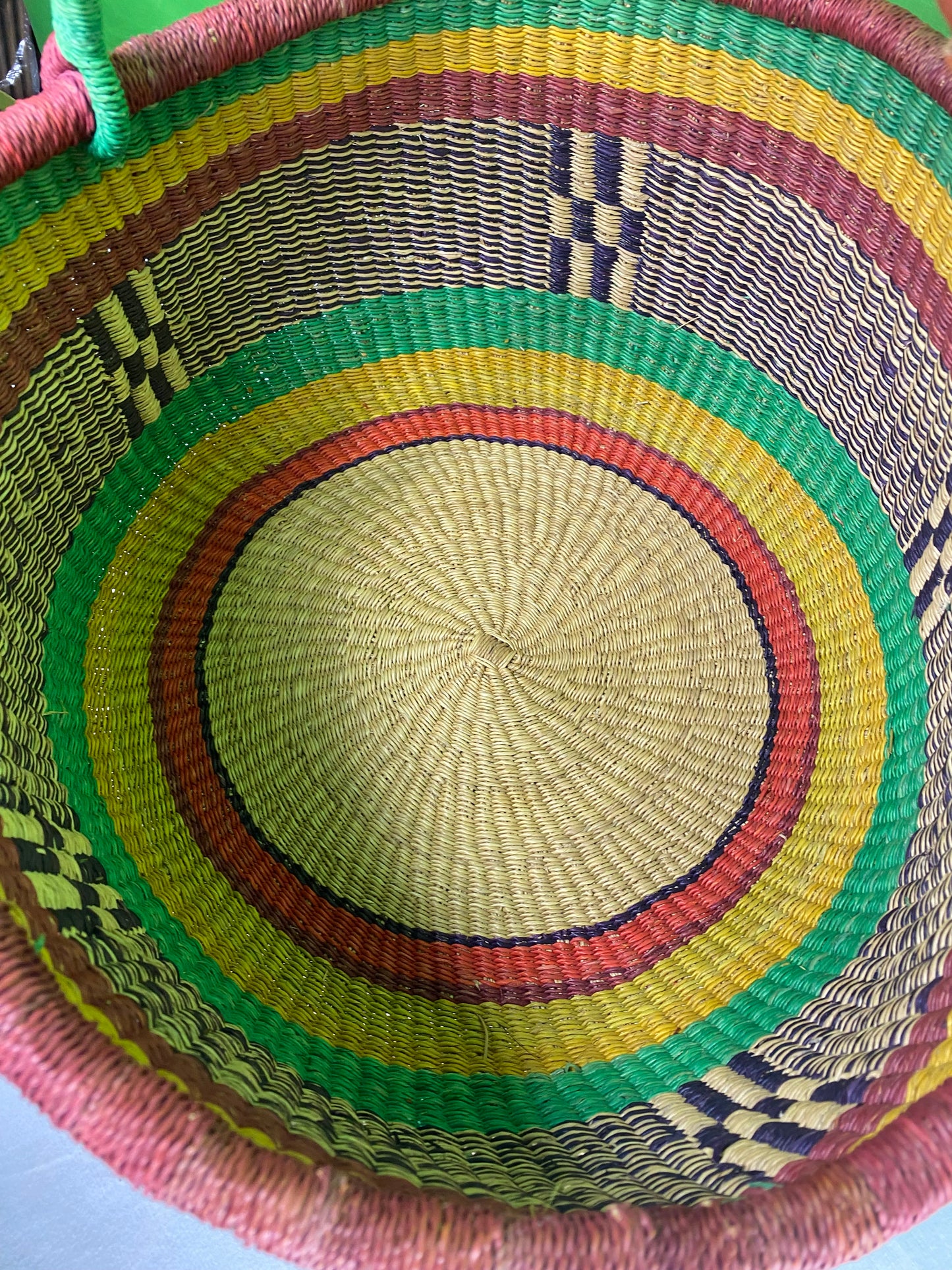 A Beautiful Hand Woven African Basket With A Leather Bound Handle