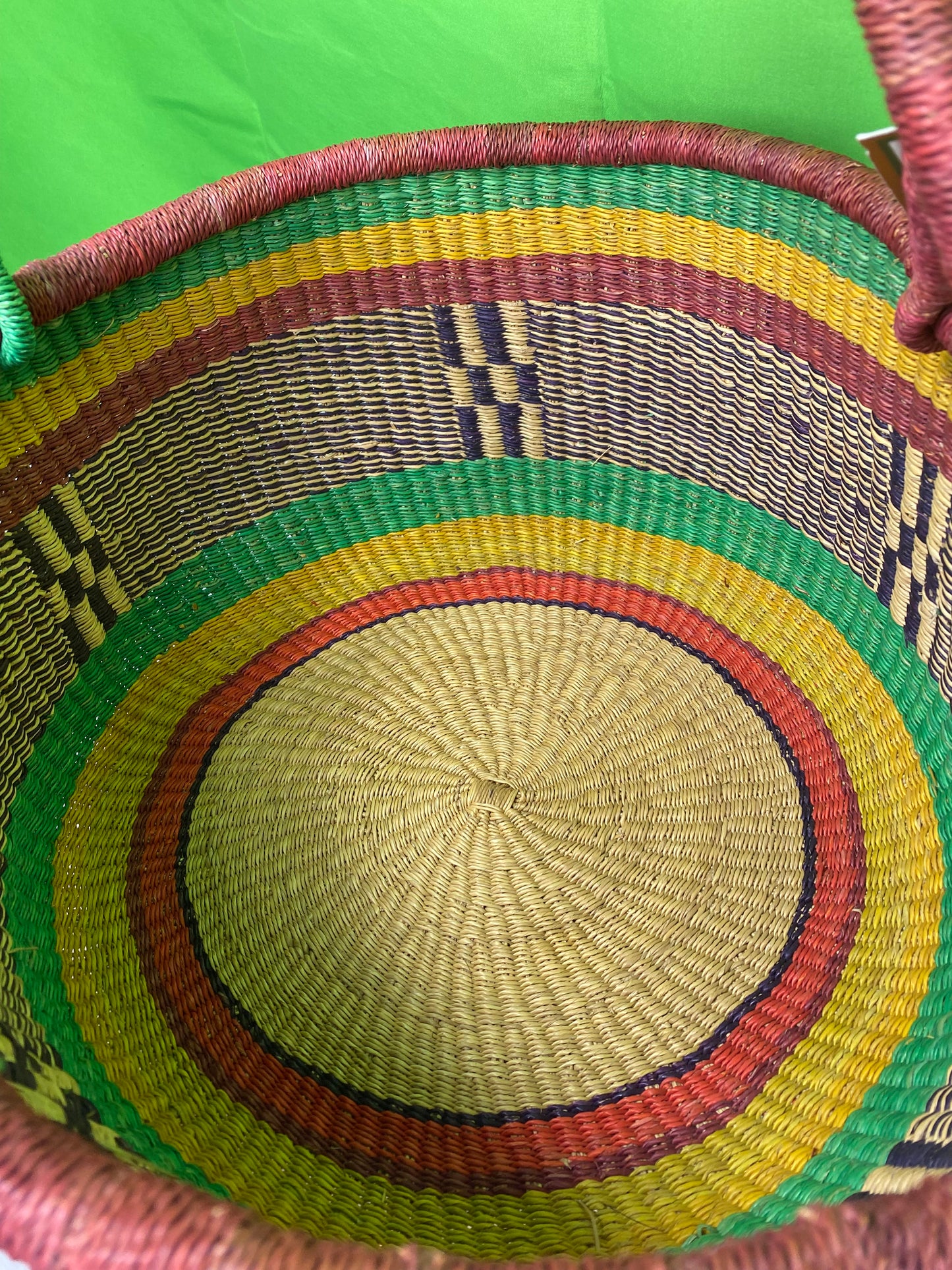 A Beautiful Hand Woven African Basket With A Leather Bound Handle