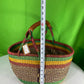 A Beautiful Hand Woven African Basket With A Leather Bound Handle