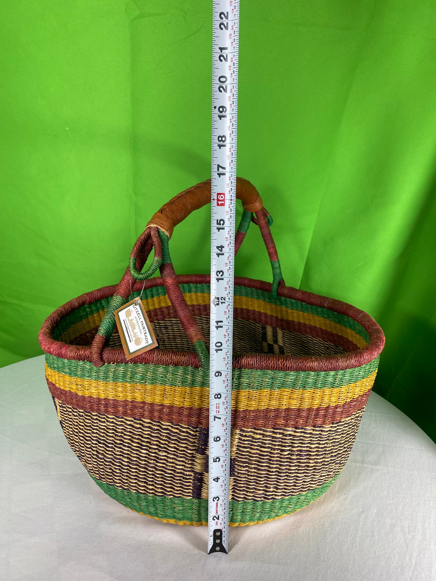 A Beautiful Hand Woven African Basket With A Leather Bound Handle